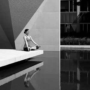 lady doing yoga at a reflection pond - thumbnail